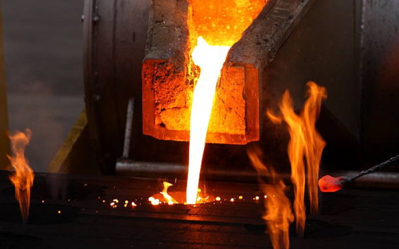 Molten metal poured from lathe for iron casting.